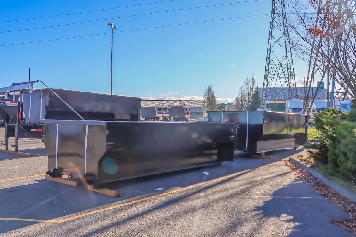 Roll-off dumpster ready for waste disposal at job site for 12 Yard Dumpster Rental in Almont